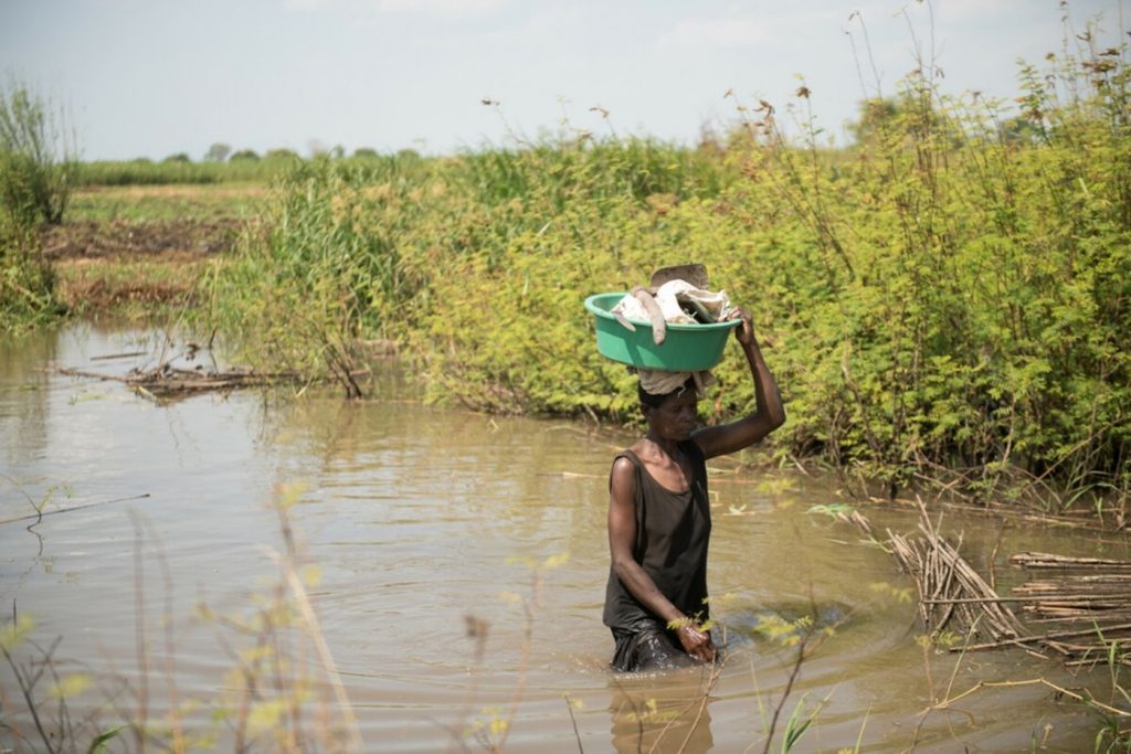 Woman crossing river